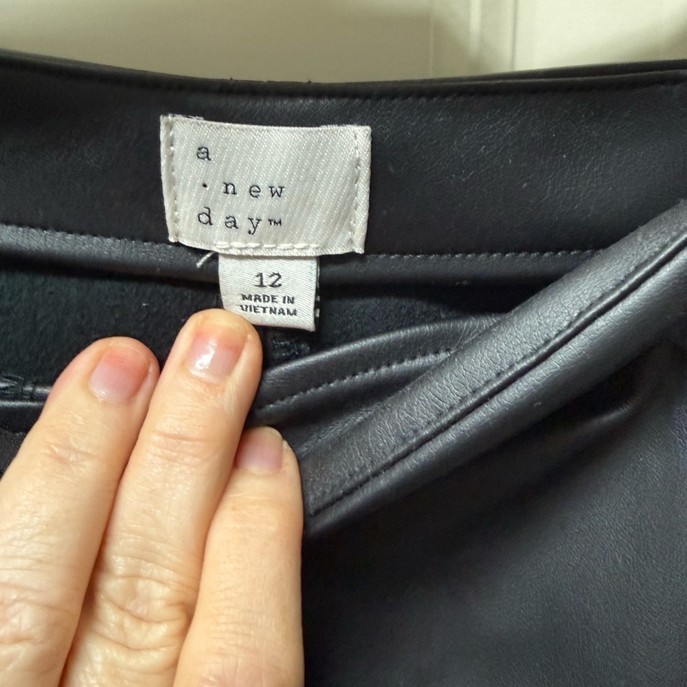Black pleather skirt.  Side zip. Size 12 - Picture 2 of 2